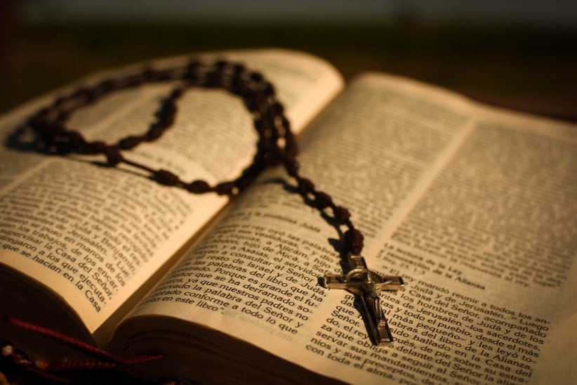 Bible with Rosary Bead